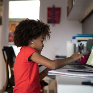 photo - Elementary Girl Studying on Laptop