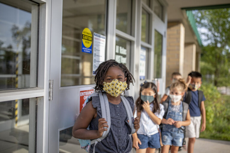 photo - Elementary School Students Wearing Masks and Returning to School