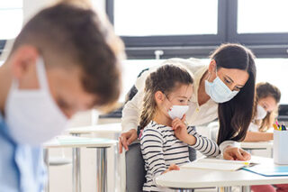photo - Elementary Students and Teacher Wearing Masks in Classroom