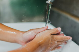Photo of child washing hands