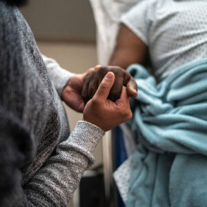 Photo - Holding Hands In Hospital