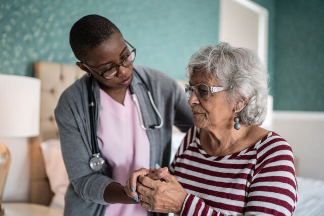 photo - Home Healthcare Nurse Helping Senior Woman