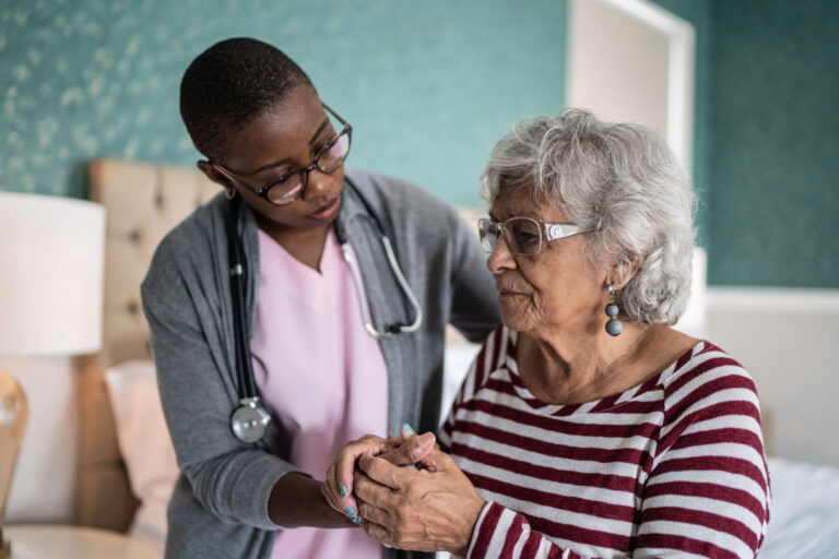 photo - Home Healthcare Nurse Helping Senior Woman