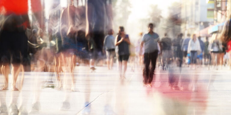 photo - Motion Blurred Pedestrians on Boardwalk