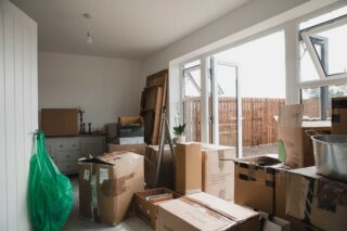 photo - Moving Boxes in Living Room of New Home