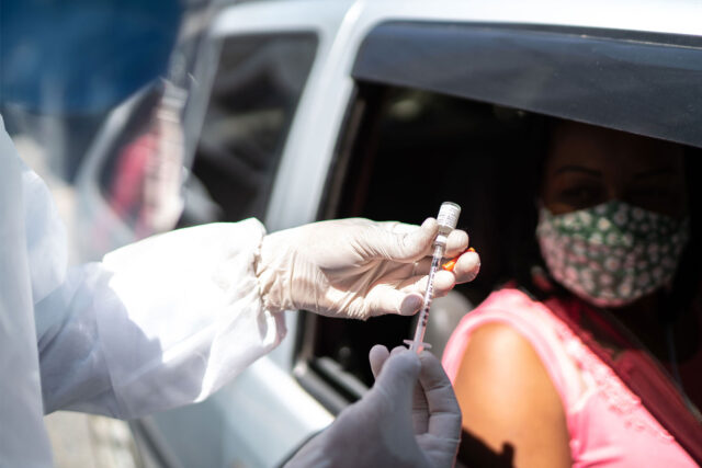 photo - Nurse Preparing Vaccine at the Drive-Through Distribution Site