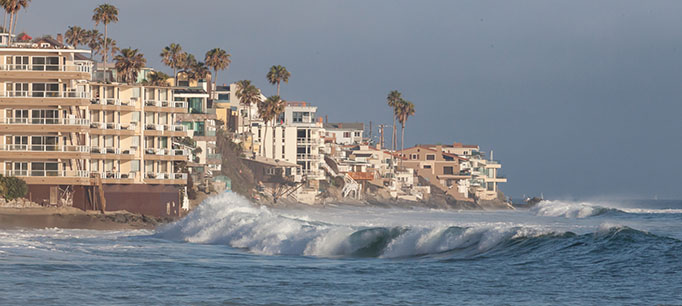 photo - Ocean Waves Hitting Housing on Southern California Coastal Housing