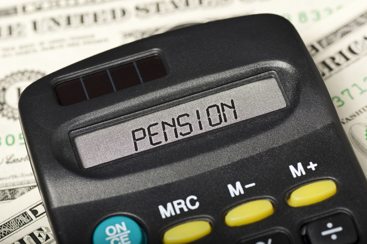 photo - Pension on Calculator Display and Money