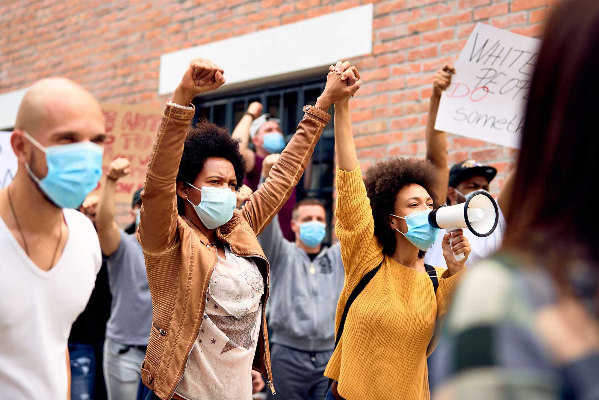 photo - People Wearing Protective Masks While Protesting at an Anti-Racism Demonstration