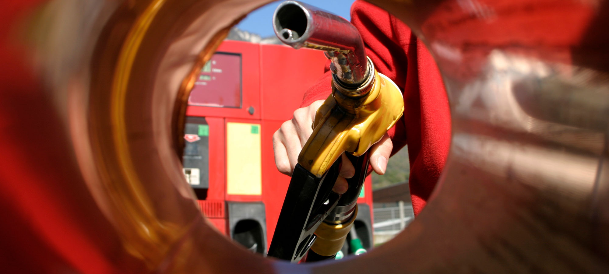 photo - Person Filling Up the Car in a Gas Station