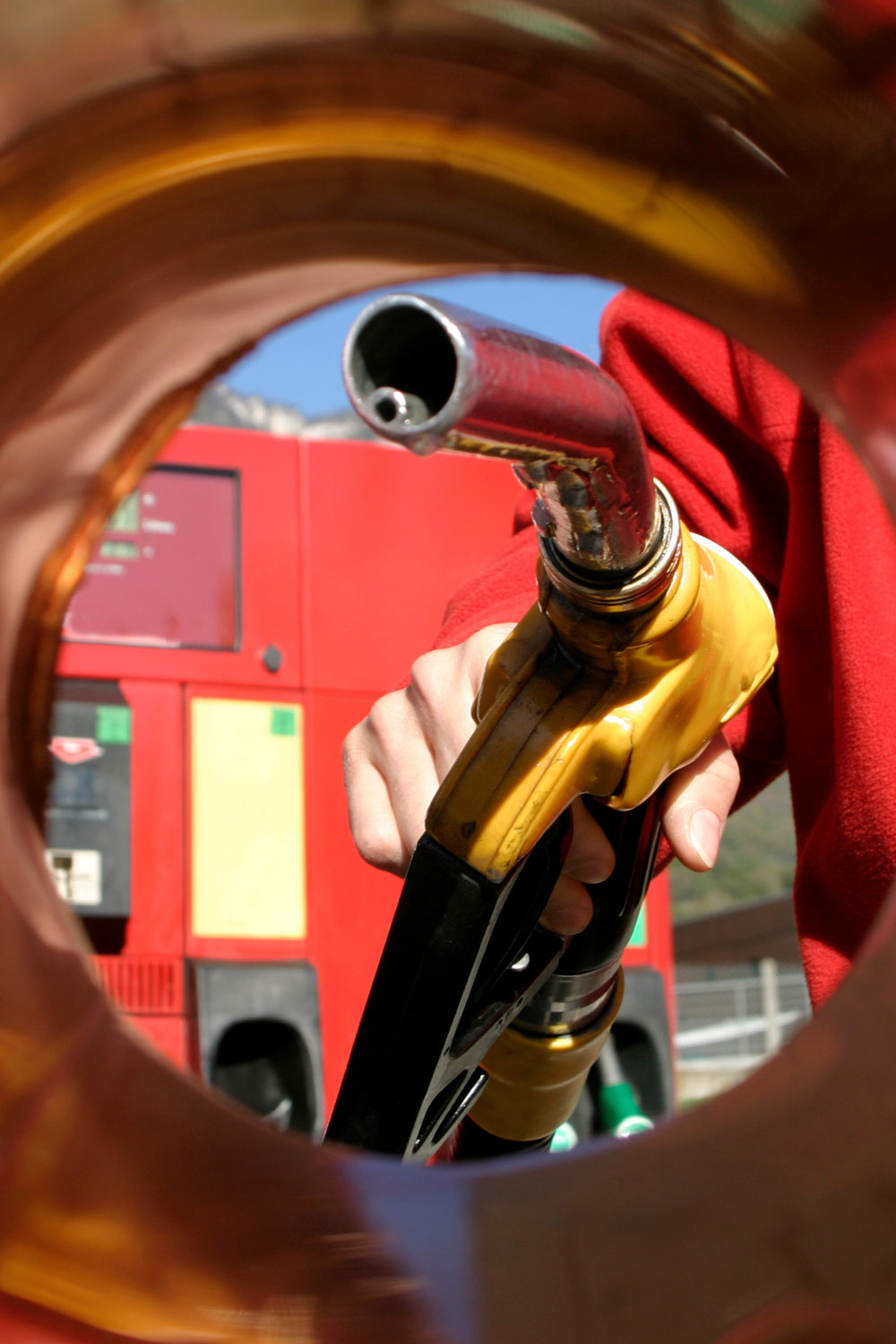 photo - Person Filling Up the Car in a Gas Station