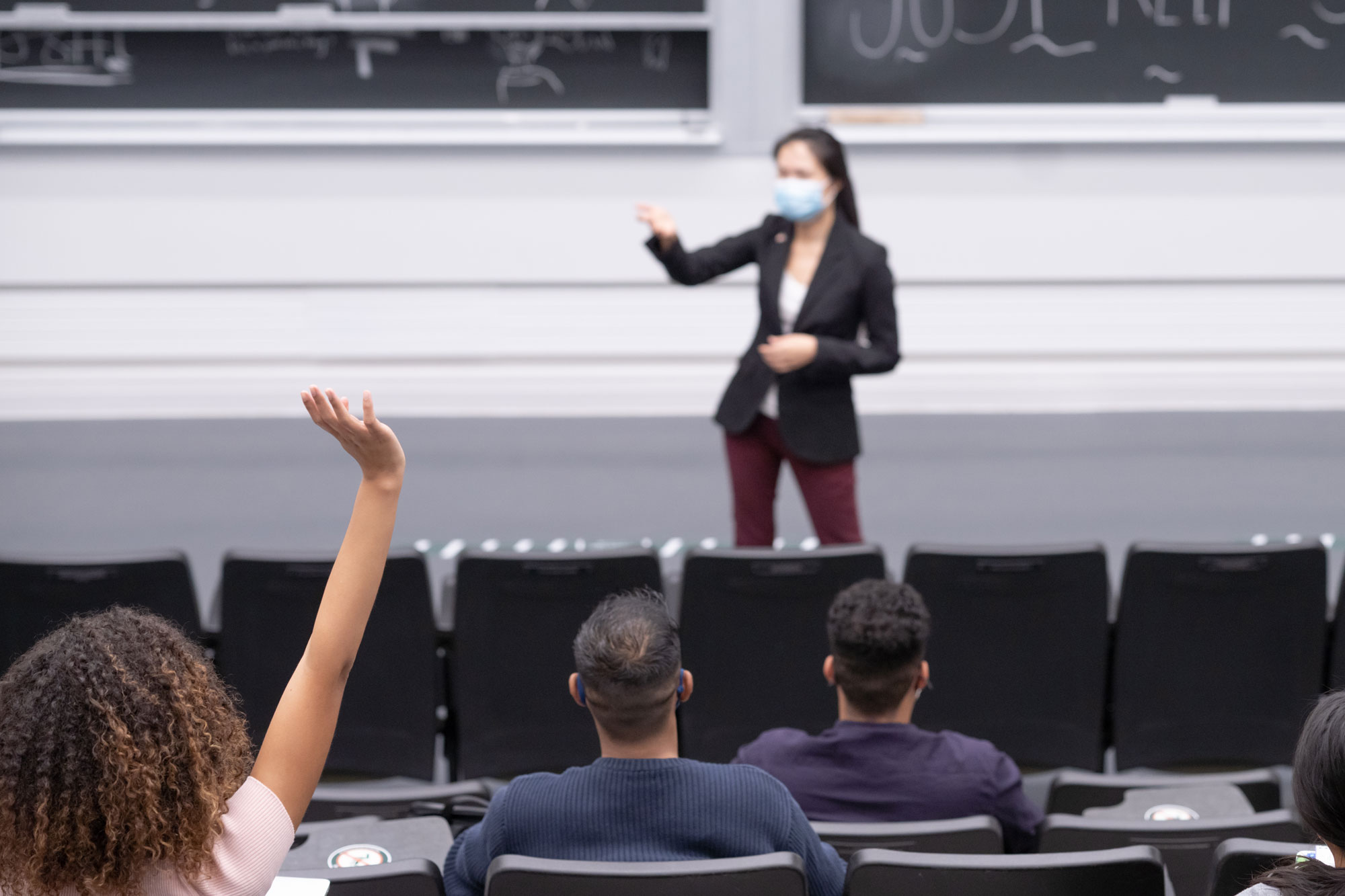 photo - Professor Wearing Mask and Lecturing to Students