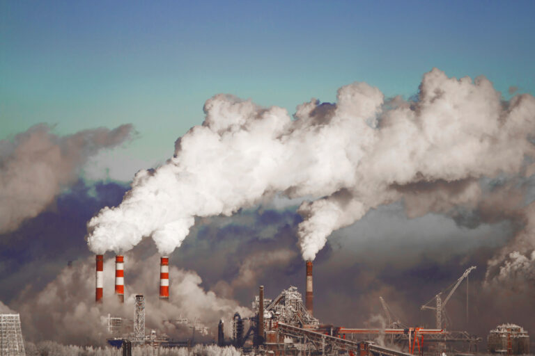 photo - Smoke stacks causing pollution into the environment