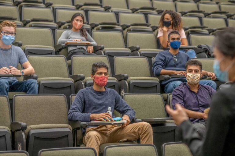 photo - Students wearing masks in a lecture hall