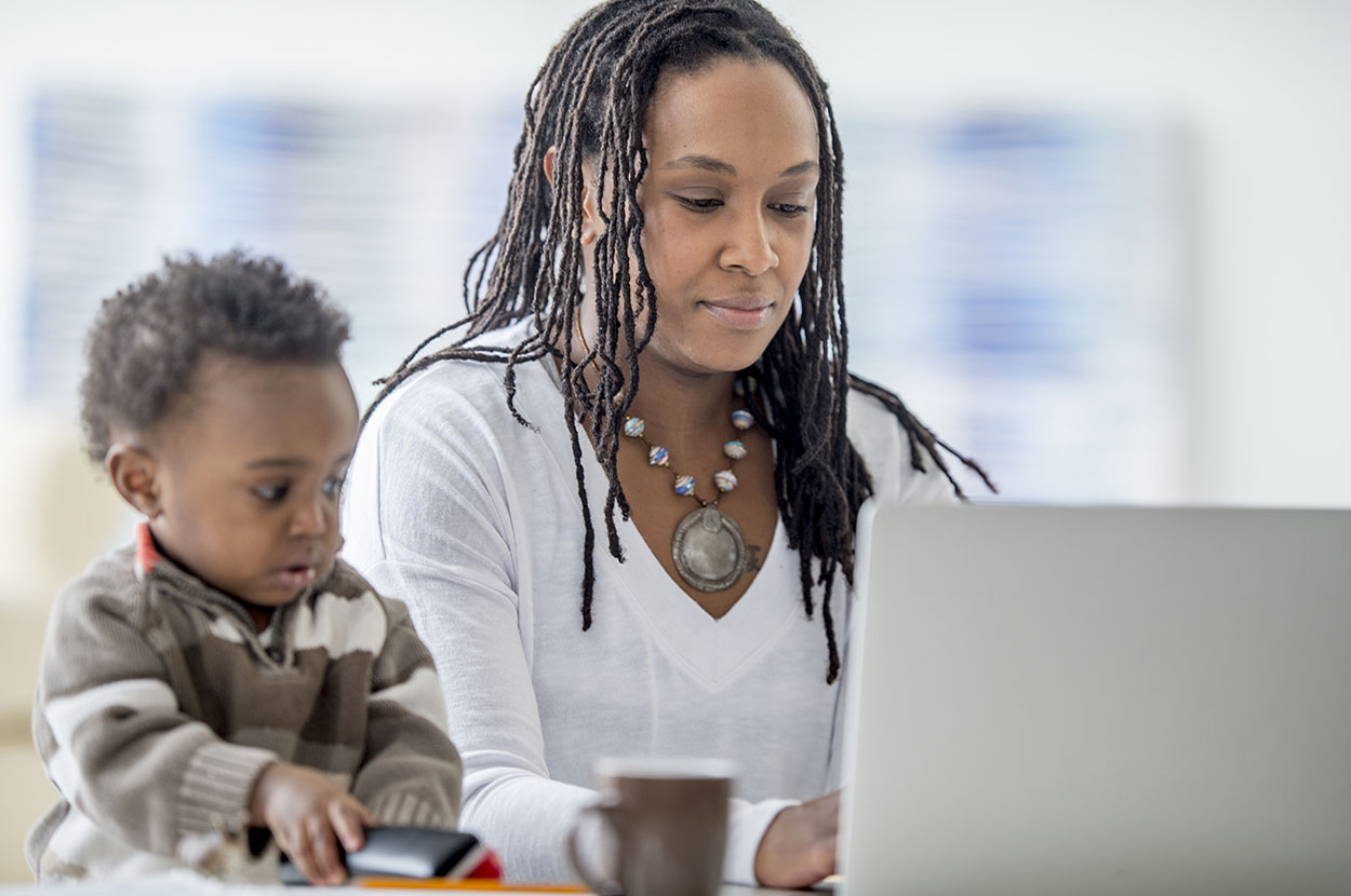 photo - Toddler and Mother on Lap Top