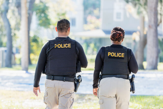 photo - Two Police Officers Walking in the Neighborhood