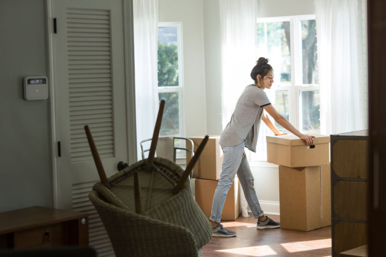 photo - Woman Packing Up Apartment