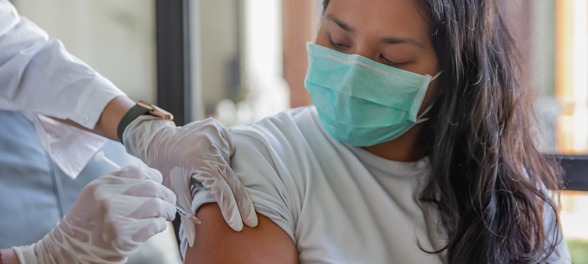photo - Woman Receiving COVID-19 Vaccine at Home