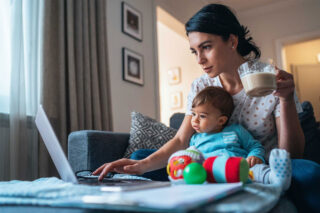 photo - Woman with Baby Working from Home