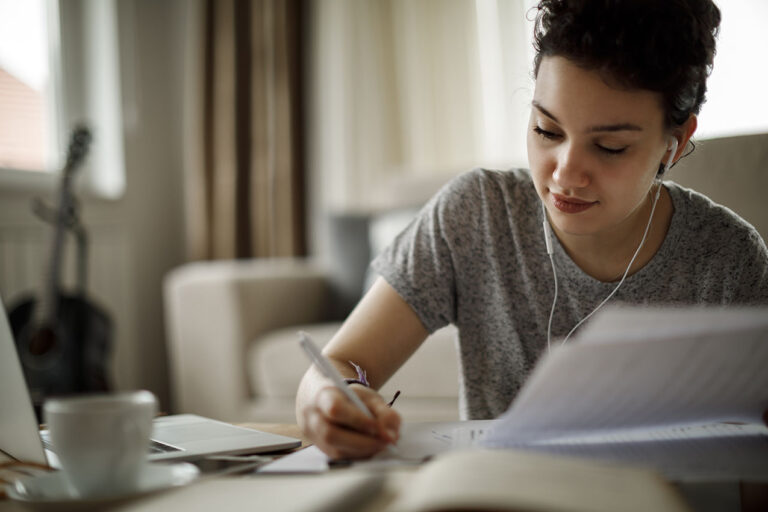 photo - Young Woman Studying at Home