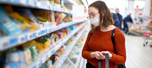 photo - Young Woman Wearing Mask and Grocery Shopping